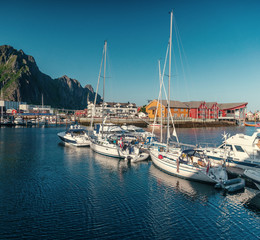 Fototapeta na wymiar View of the city of Svolvaer, Norway, Lofoten Islands, beautiful summer landscape, houses and yachts on a background of mountains