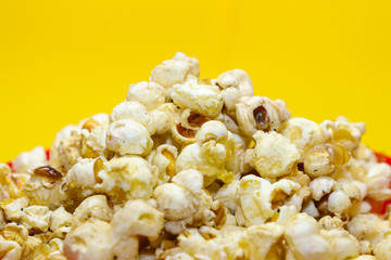 popcorn isolated on yellow background