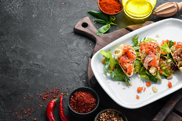 Avocado, salmon and egg sandwich. Restaurant dishes. Top view. Free space for your text.