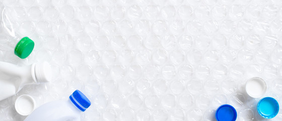 Various plastic waste on the white banner