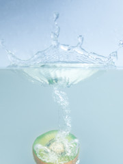 Kiwi fruit drop in water