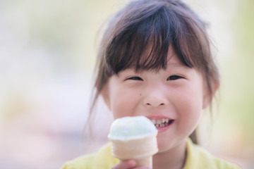 Asian little girl eating icecream