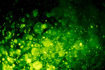 Abstract Green bokeh defocus glitter blur Background.