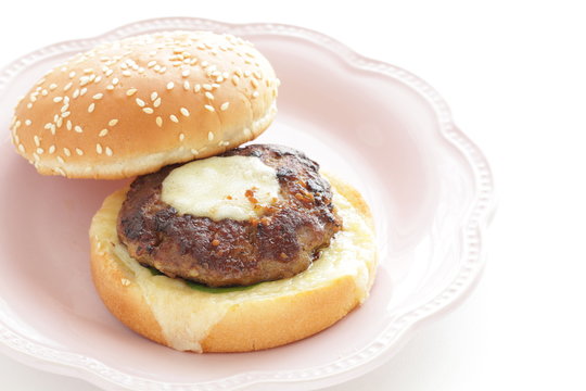 Homemade patty burger on dish for comfort food image