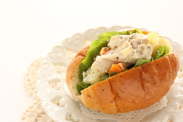 Chicken and potato mayonnaise salad in bun sandwich