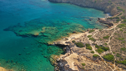 Aerial drone photo of emerald crystal clear sea rocky beach of Plakes in famous island of Astypalaia, Dodecanese, Greece