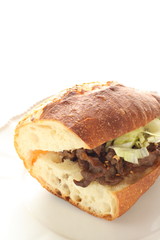 Homemade grilled beef and vegetable in French bread sandwich