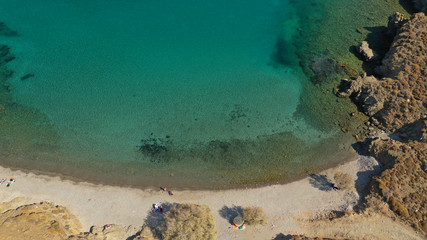 Aerial drone photo of famous calm turquoise sea sandy beaches of Steno next to small chapel of Agios Mamas, Astypalaia island, Dodecanese, Greece
