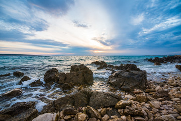 sunset on croatian stony beach