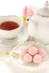 home bakery, pink cookie ball on white dish 