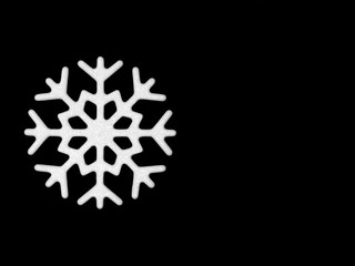 Snowflake on a black background. Winter holidays concept