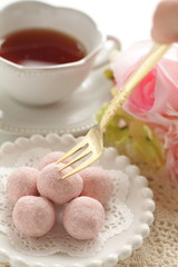 home bakery, pink cookie ball on white dish 