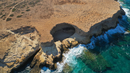 Aerial drone photo of volcanic formations of Gala rocky seascape in Pano Koufonisi island, Small Cyclades, Greece