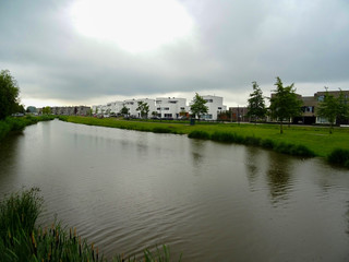 Fototapeta na wymiar landscape with canal and blue sky in Etten-Leur