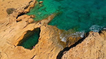 Aerial drone photo of famous devil's eye volcanic formation a natural swimming pool in Koufonisi island, Small Cyclades, Greece