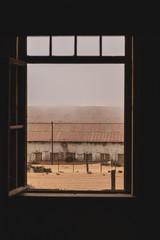 empty doorway looking out into the desert 