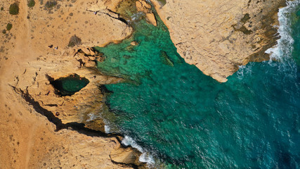 Aerial drone photo of famous devil's eye volcanic formation a natural swimming pool in Koufonisi island, Small Cyclades, Greece
