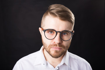 Portrait, guy and business people concept - Handsome man with glasses in white shirt looking at camera