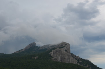 Fototapeta premium rain clouds over the rock