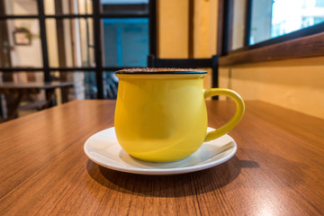 coffee latte art on the wood desk in coffee shop cafe