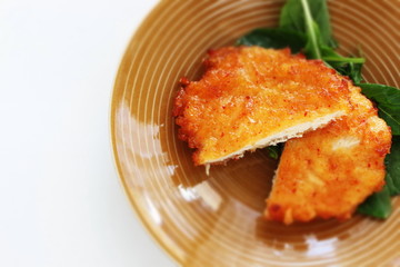 cut fried chicken on dish with copy space