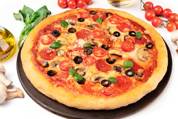 Pepperoni pizza with ingredients on a white background, close-up shot