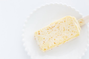 mango ice bar on white dish with copy space