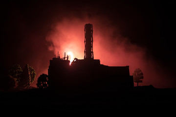 Fototapeta premium Creative artwork decoration. Chernobyl nuclear power plant at night. Layout of abandoned Chernobyl station after nuclear reactor explosion.