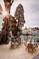 Old town street and restarurant tables in Lucerne city, Switzerland