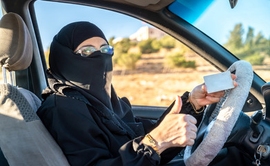 Muslim arabic woman with her driver license