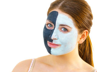 Girl with black white mud mask on face