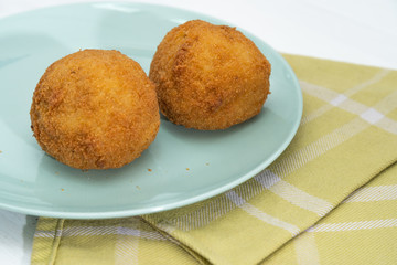 Sicilian Arancino or Arancina. A typical Sicilian street food.
