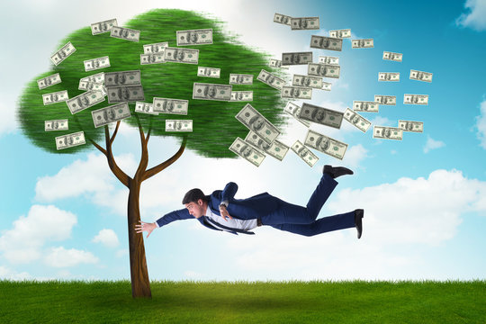 Businessman blown away from the money tree