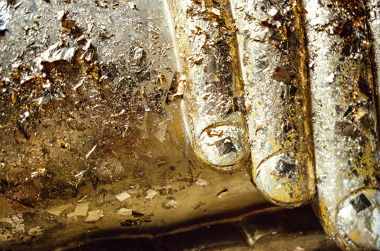 Detail of a Buddha statue covered by gold in Kanchanaburi, Thailand