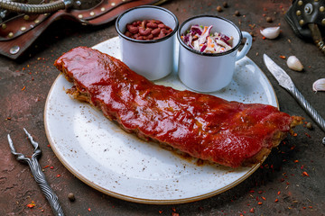 Barbecue pork ribs on dark concrete rustic table