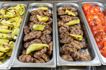 Grilled meat and vegetables in a tray, closeup. Food concept