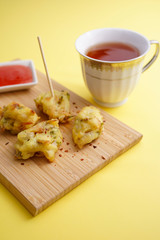 Close up of a crunchy Cucur Ikan Bilis or Anchovies Fritters a Malay traditional evening dish