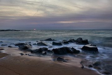 Sunrise at sea with rocks