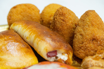 Sicilian Cartocciata, Pizzetta, Cipollina and Arancino. A typical street food from Sicily.