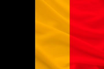 national flag of belgium on gentle silk with wind folds, travel concept, immigration, politics, copy space, close-up