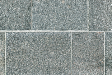 Fototapeta premium Paving of grey natural stone, rectangular format, laid in rows