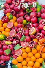 Oranges pomegranate grapefruit lime in the street market. Juicy fresh fruit for fresh juice.