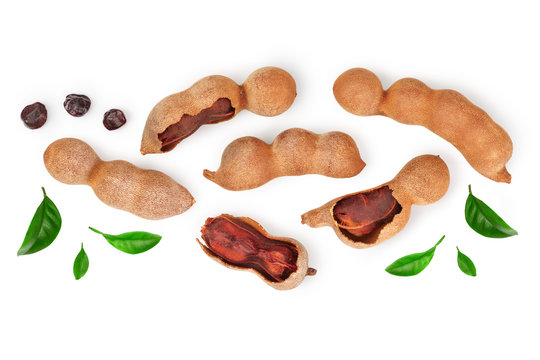 Tamarind fruit with leaf and seed isolated on white background with copy space for your text. Top view. Flat lay