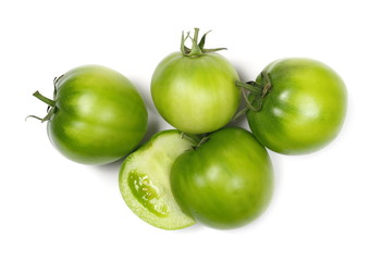 Half green unripe tomatoes isolated on white background, top view