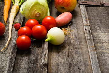 fresh fruits and vegetables on old weathered wooden