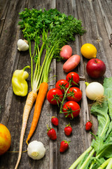 fresh fruits and vegetables on old weathered wooden