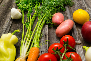 fresh fruits and vegetables on old weathered wooden