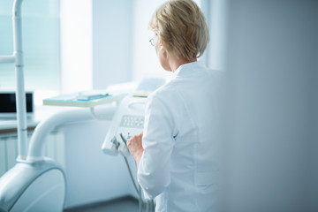 Female doctor is staying in her office