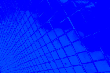 Beautiful closeup textures abstract color dark blue and purple tiles granite and blue glass pattern wall and background and art