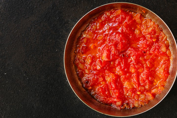 tomato sauce, skinless tomatoes - red and ripe fruits chopped, concept. food background. copy space